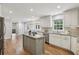 Bright kitchen with stainless steel appliances, white cabinetry, and a breakfast nook with natural light at 5349 Forest Springs Dr, Dunwoody, GA 30338