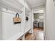Mud room with built-in cubbies, bench, and a view of the adjacent laundry room at 5349 Forest Springs Dr, Dunwoody, GA 30338