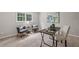 Comfortable home office features two chairs, a desk and lots of natural light at 5349 Forest Springs Dr, Dunwoody, GA 30338