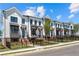 Charming townhome community featuring modern design, well-maintained lawns, and wrought iron fencing at 630 Skytop Dr # 157, Cumming, GA 30040
