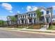 Modern townhome exteriors with black frame windows and well-manicured landscaping, perfect for suburban living at 630 Skytop Dr # 157, Cumming, GA 30040