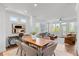 Open-concept dining/living room with ample natural light and modern furnishings at 630 Skytop Dr # 157, Cumming, GA 30040