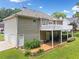 Back exterior featuring an elevated deck, patio, and a two-car garage at 6355 Autumn View Nw Pt, Acworth, GA 30101