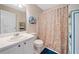 Bathroom featuring a single sink vanity and a decorative shower curtain at 6355 Autumn View Nw Pt, Acworth, GA 30101