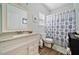 Bathroom featuring a single sink vanity and a shower with decorative curtain at 6355 Autumn View Nw Pt, Acworth, GA 30101