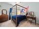 Bedroom with a four post bed frame, a tapestry, and a dresser at 6355 Autumn View Nw Pt, Acworth, GA 30101