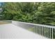 Deck overlooking a backyard with mature trees providing lots of shade at 6355 Autumn View Nw Pt, Acworth, GA 30101