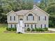 Charming two-story home with a well-manicured lawn and inviting front porch at 6355 Autumn View Nw Pt, Acworth, GA 30101