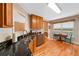 Well-lit kitchen with granite counters, stainless steel appliances, and hardwood floors at 6355 Autumn View Nw Pt, Acworth, GA 30101