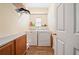 Laundry room featuring wood look tile flooring, a washer, and a dryer at 6355 Autumn View Nw Pt, Acworth, GA 30101