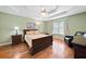 Tranquil bedroom with tray ceiling, hardwood floors, and ample natural light at 6355 Autumn View Nw Pt, Acworth, GA 30101