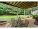 Outdoor patio featuring seating, a grill, and a view of the backyard at 6355 Autumn View Nw Pt, Acworth, GA 30101