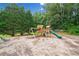 Community playground with slide, swing, and wooden play structure at 6355 Autumn View Nw Pt, Acworth, GA 30101