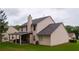 View of backyard with covered patio and a chimney at 1332 Chandler Cove Way, Grayson, GA 30017