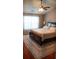 Comfortable primary bedroom with a dark wood bed, and a ceiling fan; features a large area rug at 1332 Chandler Cove Way, Grayson, GA 30017