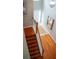 Elegant two-story entryway with hardwood stairs and tiled floors; features natural light from the front door at 1332 Chandler Cove Way, Grayson, GA 30017