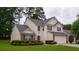 Charming two-story home with well-manicured lawn and brick accents, perfect for suburban living at 1332 Chandler Cove Way, Grayson, GA 30017