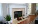 Close up on the fireplace in the living room with decorative accents at 1332 Chandler Cove Way, Grayson, GA 30017