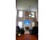 Bright living room featuring a fireplace, high ceilings, and comfortable leather seating at 1332 Chandler Cove Way, Grayson, GA 30017