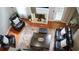 Overhead view of living room with fireplace, seating, and dark wood floors at 1332 Chandler Cove Way, Grayson, GA 30017