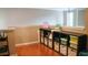 Cozy loft area with hardwood floors and cube storage shelves with baskets and bins for organization at 1332 Chandler Cove Way, Grayson, GA 30017