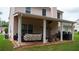 Covered patio with outdoor furniture and a ceiling fan at 1332 Chandler Cove Way, Grayson, GA 30017