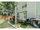 Backyard patio area featuring a metal pergola, seating and a grill at 2512 Halcyon Way, Lawrenceville, GA 30044