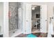 Bathroom features a walk-in shower, tile and hardwood floors at 2512 Halcyon Way, Lawrenceville, GA 30044