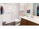 Bright bathroom with white shower/tub combo, and wood vanity at 2512 Halcyon Way, Lawrenceville, GA 30044