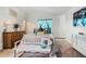 Inviting bedroom with bright turquoise decor, complemented by a comfortable white bench at 2512 Halcyon Way, Lawrenceville, GA 30044