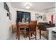 Cozy dining area with wood table and seating, decor, and natural lighting at 2512 Halcyon Way, Lawrenceville, GA 30044