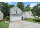 Charming home with two-car garage, black shutters, basketball hoop, and manicured lawn at 2512 Halcyon Way, Lawrenceville, GA 30044