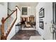 Inviting foyer with hardwood floors, staircase, soaring ceilings, and entry to living room at 2512 Halcyon Way, Lawrenceville, GA 30044