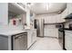 Bright kitchen features white cabinets, stainless steel appliances, and modern countertops at 2512 Halcyon Way, Lawrenceville, GA 30044