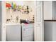 A well-lit laundry room with a washer and dryer at 2512 Halcyon Way, Lawrenceville, GA 30044