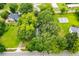 An aerial view of a home surrounded by lush green trees at 6539 E Strickland St, Douglasville, GA 30134