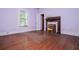 Bedroom features original hardwood flooring and window with lots of natural light at 6539 E Strickland St, Douglasville, GA 30134