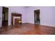 Bedroom featuring fireplace and hardwood flooring, doorways to other rooms at 6539 E Strickland St, Douglasville, GA 30134