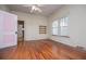 This bedroom has hardwood floors, a ceiling fan and open shelves at 6539 E Strickland St, Douglasville, GA 30134