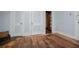 Bedroom with hardwood floors, built-in closets, and natural light at 6539 E Strickland St, Douglasville, GA 30134
