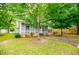 Charming single-story home with screened porch and lush front lawn, great curb appeal at 6539 E Strickland St, Douglasville, GA 30134