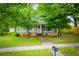 This home has a screened-in porch, green lawn, and a brick foundation at 6539 E Strickland St, Douglasville, GA 30134