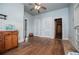 Galley style kitchen with natural wood cabinetry and wood flooring at 6539 E Strickland St, Douglasville, GA 30134