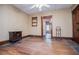 Living room with hardwood floors, ceiling fan, classic trim, and access to multiple rooms at 6539 E Strickland St, Douglasville, GA 30134