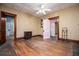 Bright living room featuring hardwood floors, a ceiling fan, and classic trim at 6539 E Strickland St, Douglasville, GA 30134