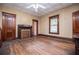 Living room boasts hardwood floors, vintage charm, and a decorative fireplace at 6539 E Strickland St, Douglasville, GA 30134