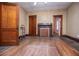 Spacious living room featuring hardwood floors, a decorative fireplace, and classic doors at 6539 E Strickland St, Douglasville, GA 30134