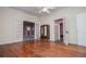 Open room featuring hardwood floors, doors and archways at 6539 E Strickland St, Douglasville, GA 30134