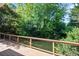 Private wooded backyard view from the spacious wood deck, great for entertaining at 1017 Mill Creek Ne Mnr, Brookhaven, GA 30319