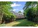 Beautifully landscaped backyard with lush greenery and a view of the home at 1017 Mill Creek Ne Mnr, Brookhaven, GA 30319
